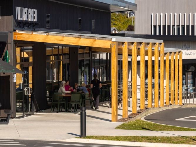 Timber pergola with people walking beneath