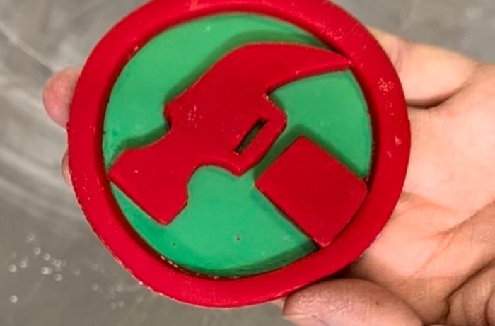 round circle with the Bunnings hammer logo on it