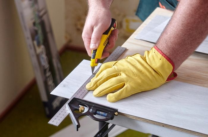 Faux wooden panels being cut to size