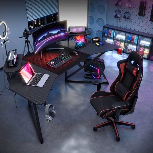 This futuristic black gaming desk features a textured surface, raised monitor stands, and built-in cup holder for peak performance. I/N: 0423630