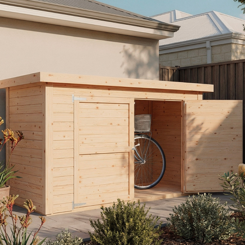Natural timber bike storage shed with a flat roof and double doors, shown partially open with a bicycle stored inside on a paved courtyard.