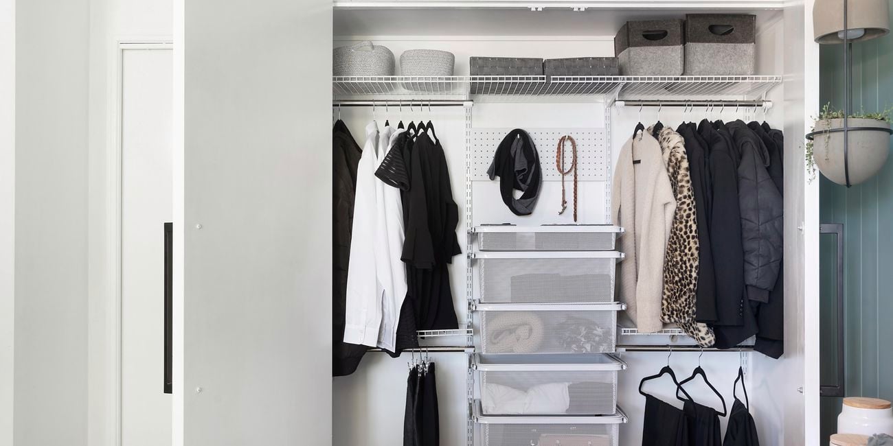 A neatly organised pantry with items in storage containers and baskets