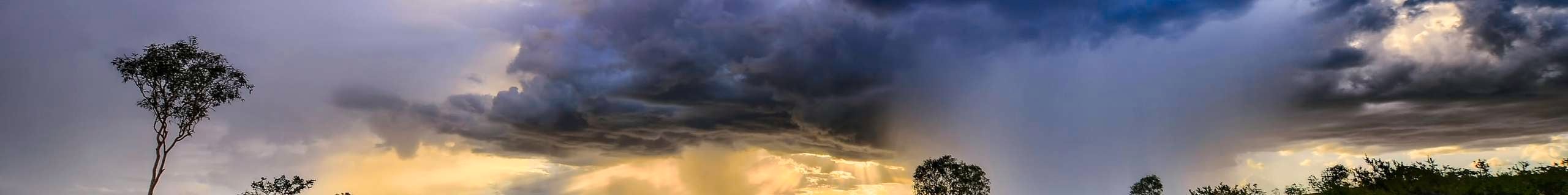 Grey clouds and rain rolling over Australian outback skyline