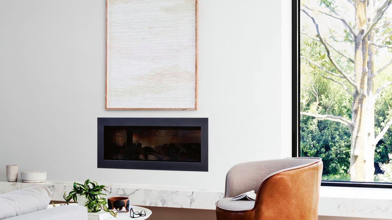 a white wall with a fireplace
