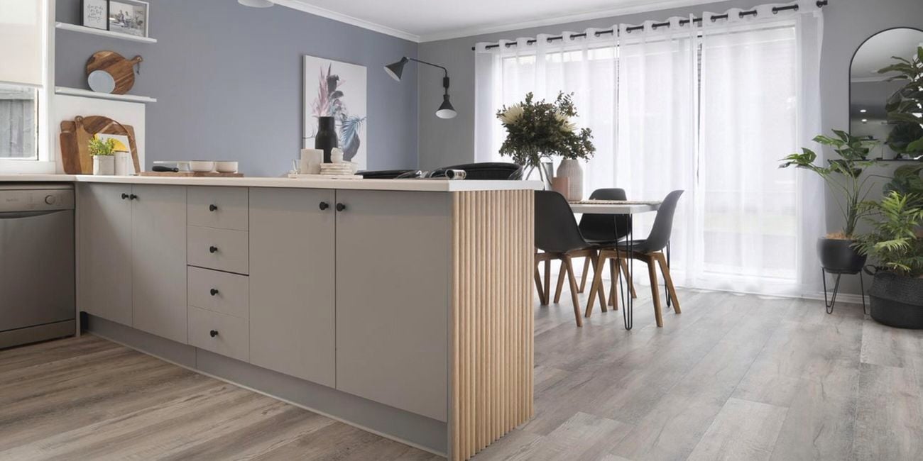 Refreshed kitchen interior, including kitchen bench and cabinets.