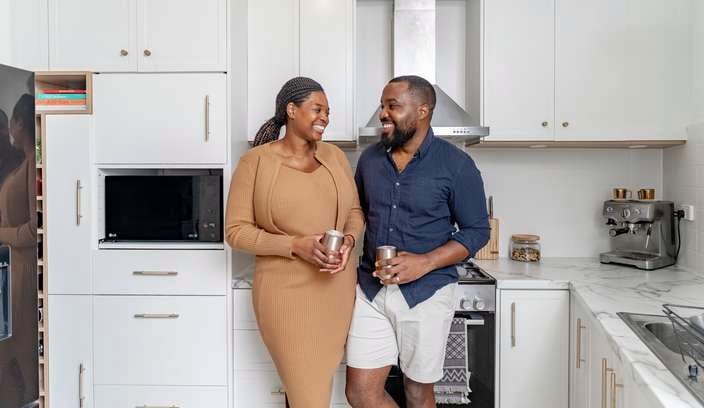 Workshop member Rufaro and partner Primrose in their renovated kitchen.