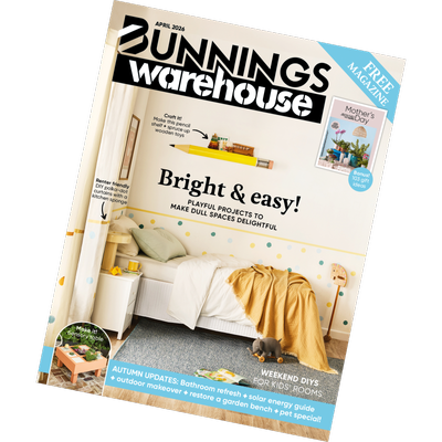 The April 2026 Bunnings Warehouse magazine cover featuring a light and colourful bedroom with polka-dot wall, white bed, yellow throw, and a small bedside table. Headline text reads “Bright & easy! Playful projects to make dull spaces delightful.” A small inset promotes Mother’s Day gift ideas.