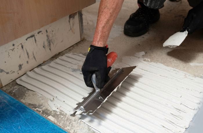 Apply tile adhesive