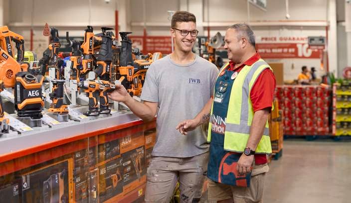 Customer and team member in the tool shop