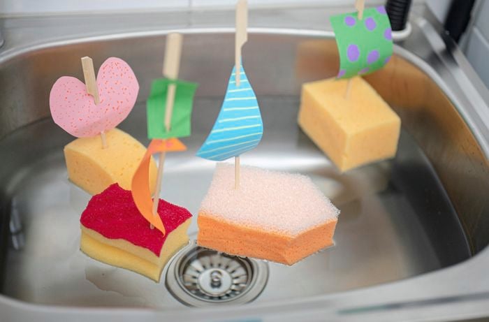 Testing out the boat in the sink filled with water.