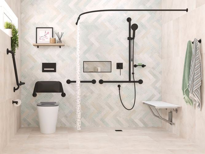 A bathroom, with a toilet, shower and bench seat against the wall in it.