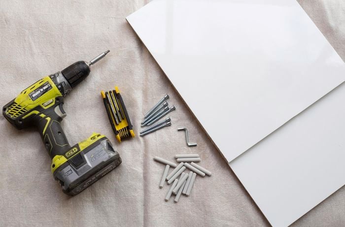 Drill, screws and MDF panels.