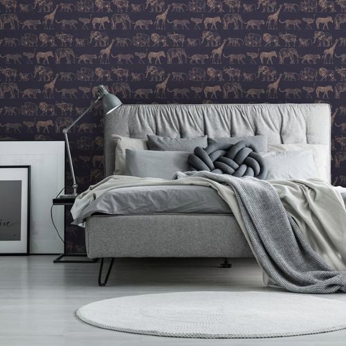 A bedroom with a Boutique wallpaper. 