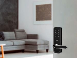 Open door to lounge room, showing security door lock