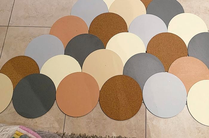 Painted cork circle mats in a pyramid formation
