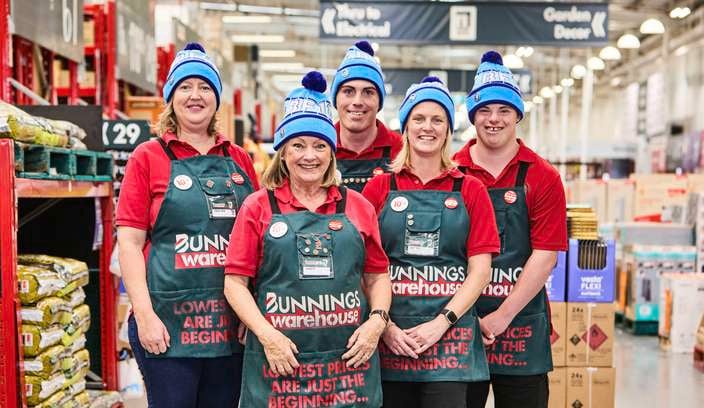 Bunnings team members in store wearing Fight MND beanies.