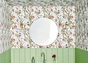 powder room with floral wallpaper and green timber wall panelling