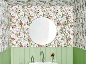 powder room with floral wallpaper and green timber wall panelling