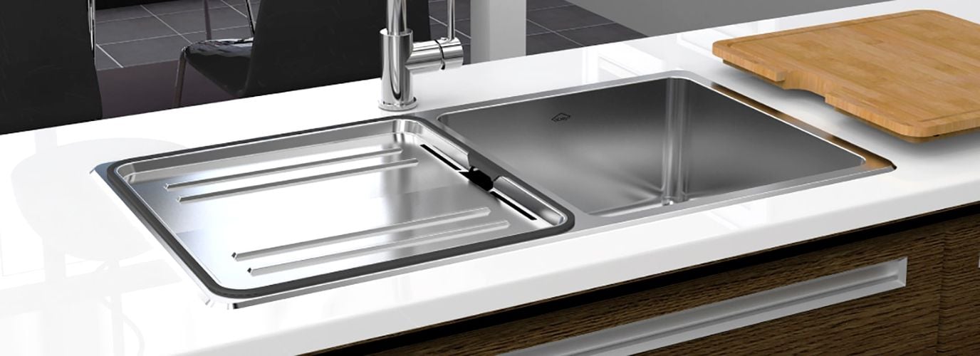 White kitchen benchtop with stainless steel sink and tapware