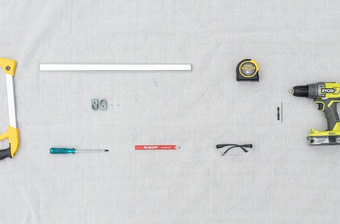 Birds eye view of tools and materials required to make a pull-out drying drawer.