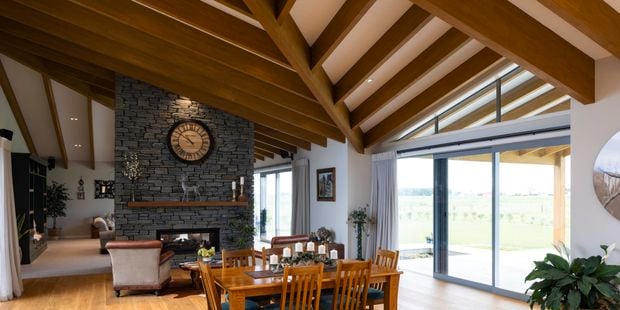 Living area with exposed floor joists above