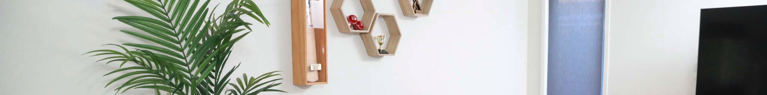 living room with floating shelves on wall