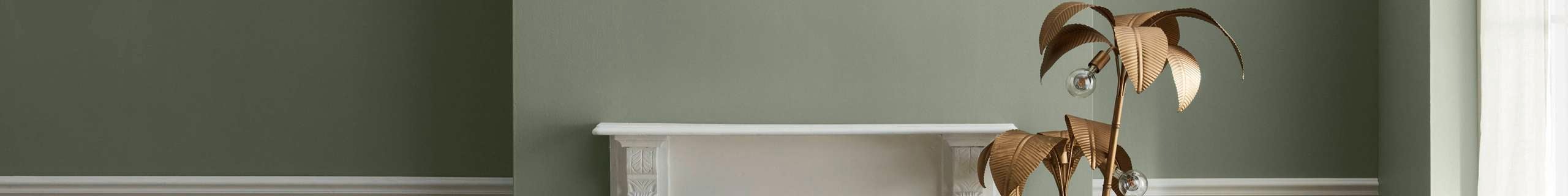 Shot of an olive-coloured wall and white fireplace for the Porter's paints brand page header