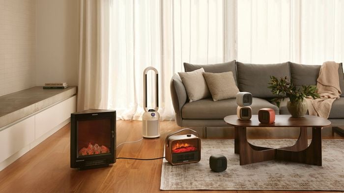 A modern furnished lounge room with timber flooring in it.