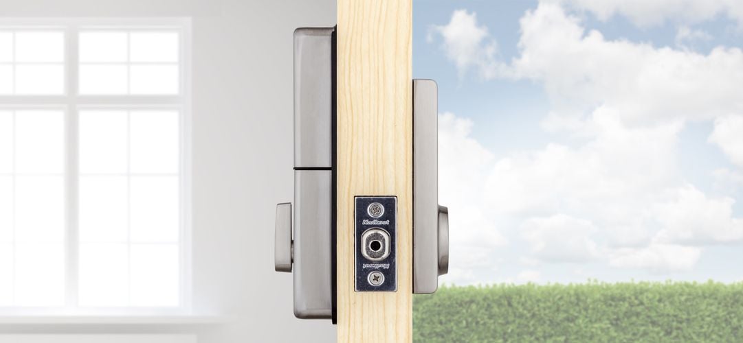Side view of front door showing exterior and interior of front door lock