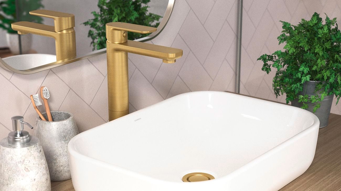 Bathroom sink with gold tapware