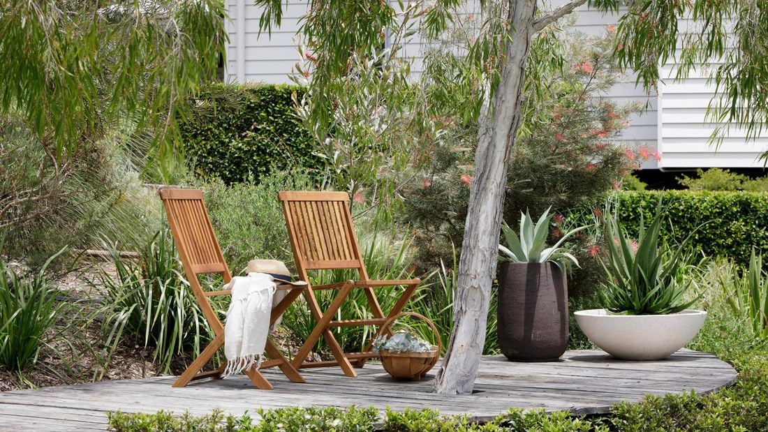 Outdoor deck surround by native plants