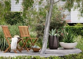 Outdoor deck surround by native plants