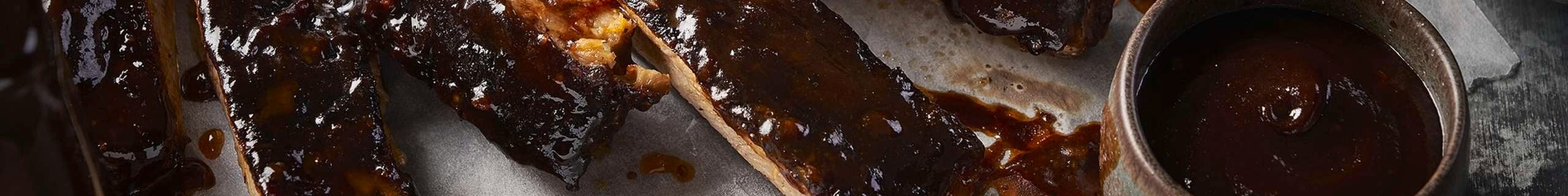 A close up of meat with sauce.