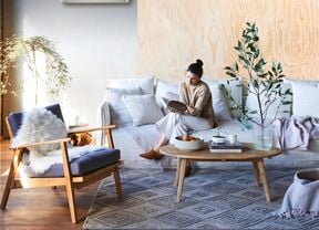 woman in a room reading a book