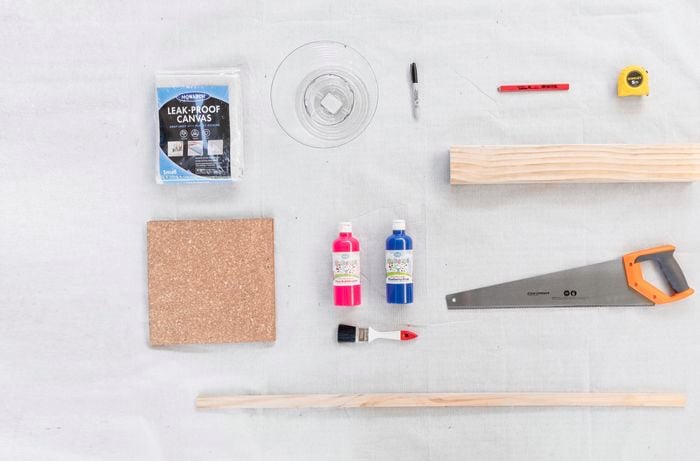 Various tools and materials to create a noughts and crosses game.