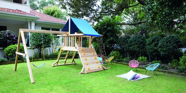 Playground and kids chairs placed in backyard