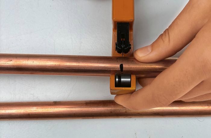 D.I.Y. photo booth frame size – cutting copper tubes to correct for assembly.