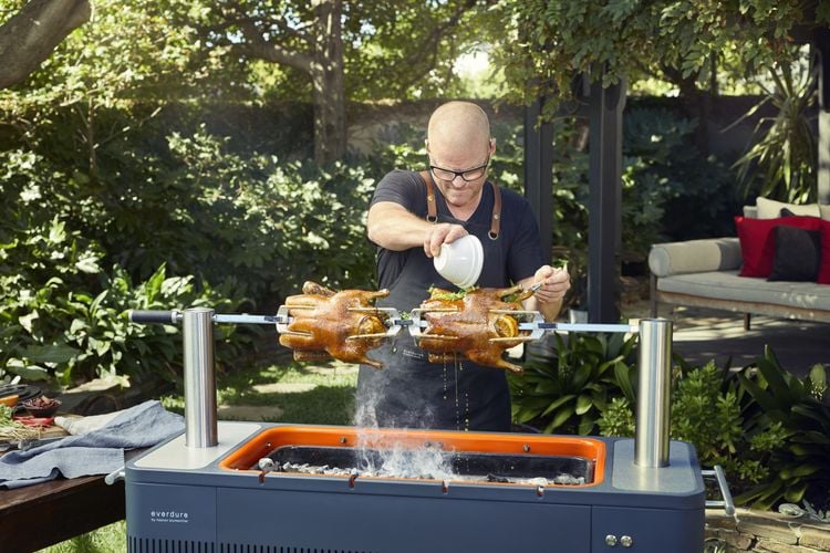 Heston Blumenthal basting a rotisserie chicken