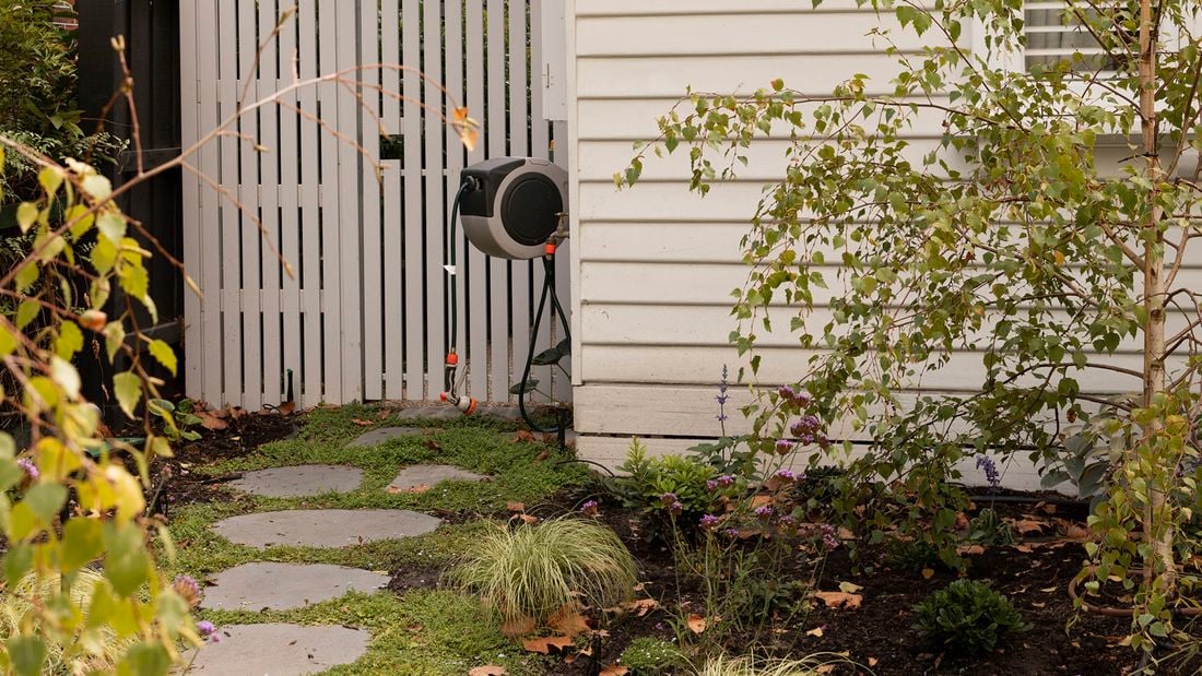 retractable hose - in a front garden setting