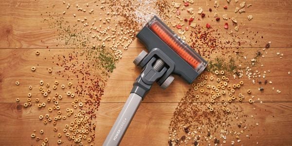 Black and decker vac cleaning a trail of rubbish