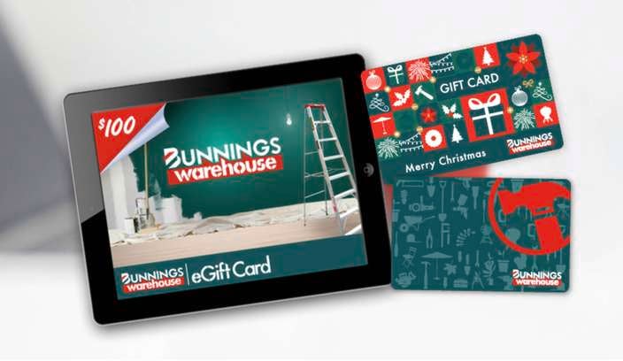 Bunnings Warehouse eGift Card displayed on a tablet alongside two physical gift cards with Christmas