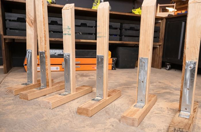 Six pine backdrop legs in a row