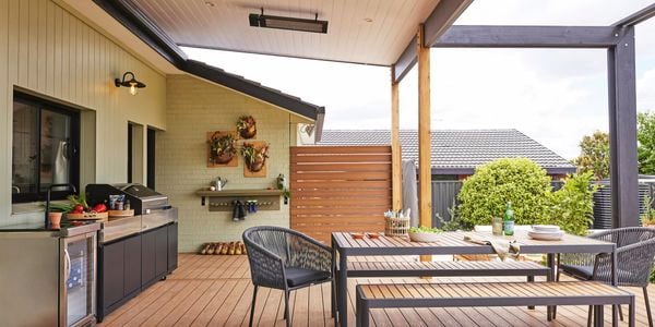 A wooden deck with outdoor furniture.