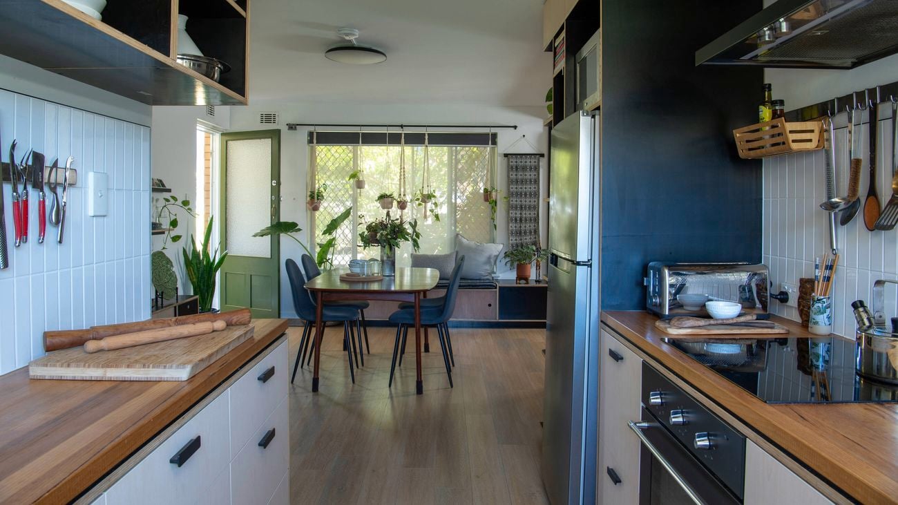 A wide shot of a kitchen, dining, living area