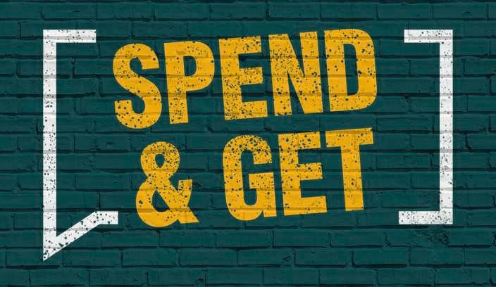 Spend and get on a green brick background