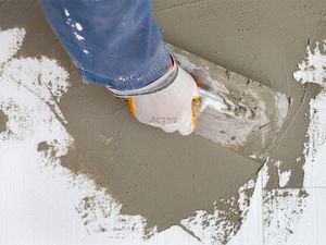 Applying cement with a trowel