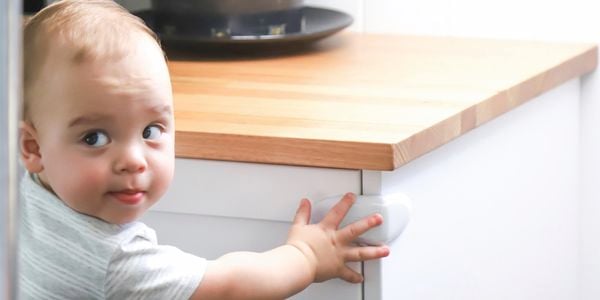 child near a cabinet