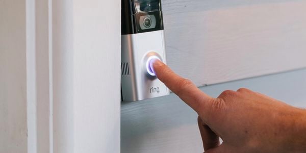 Pressing a doorbell.