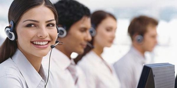 Woman helping customer on phone