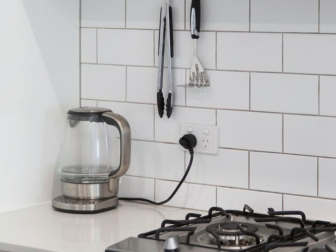 kitchen utensils on a wall
